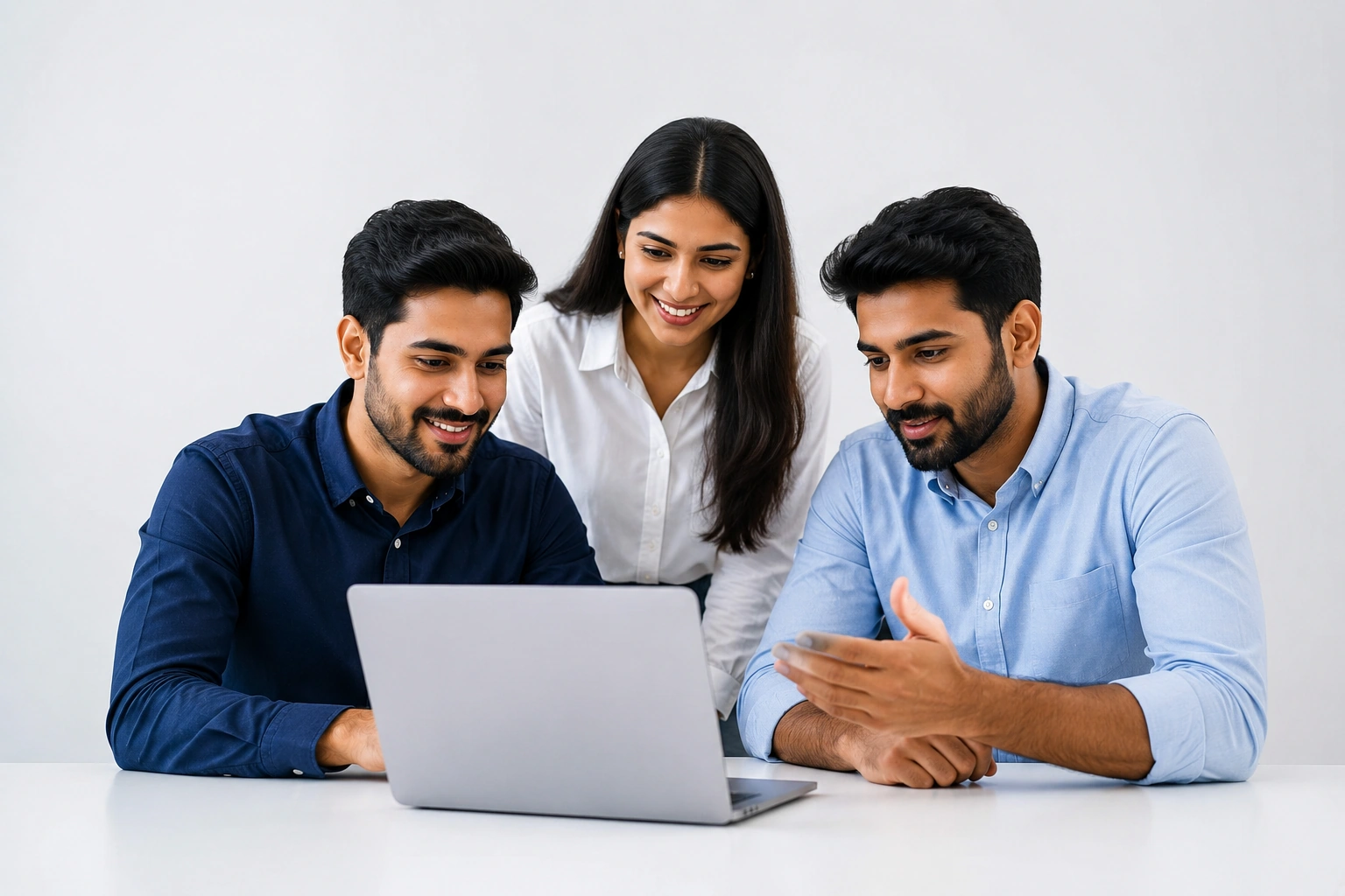 Business founders collaborating around a laptop